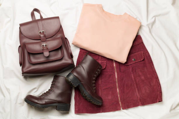 Elegant ensemble featuring chocolate brown clothes paired with burgundy accents